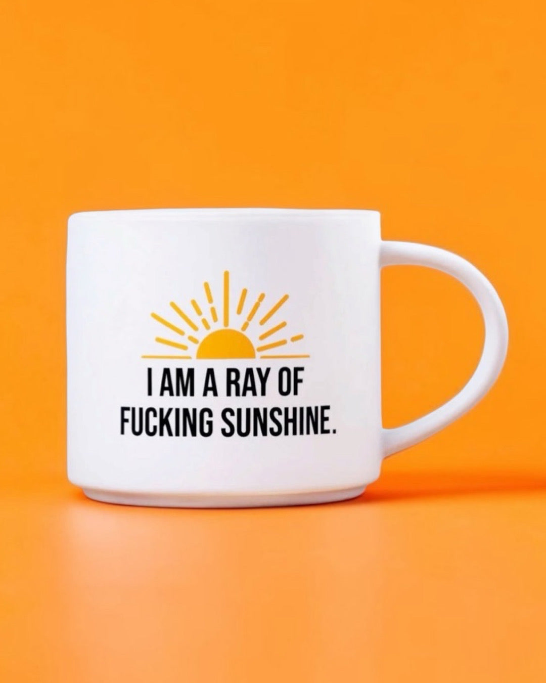 Coffee mug printed with “I am a ray of fucking sunshine.”, additional view