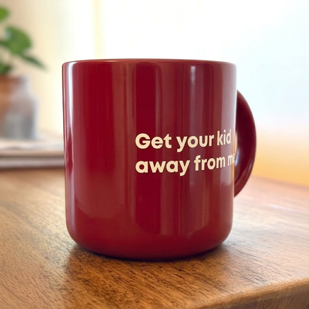 Coffee mug printed with “Get your kid away from me.”, additional view