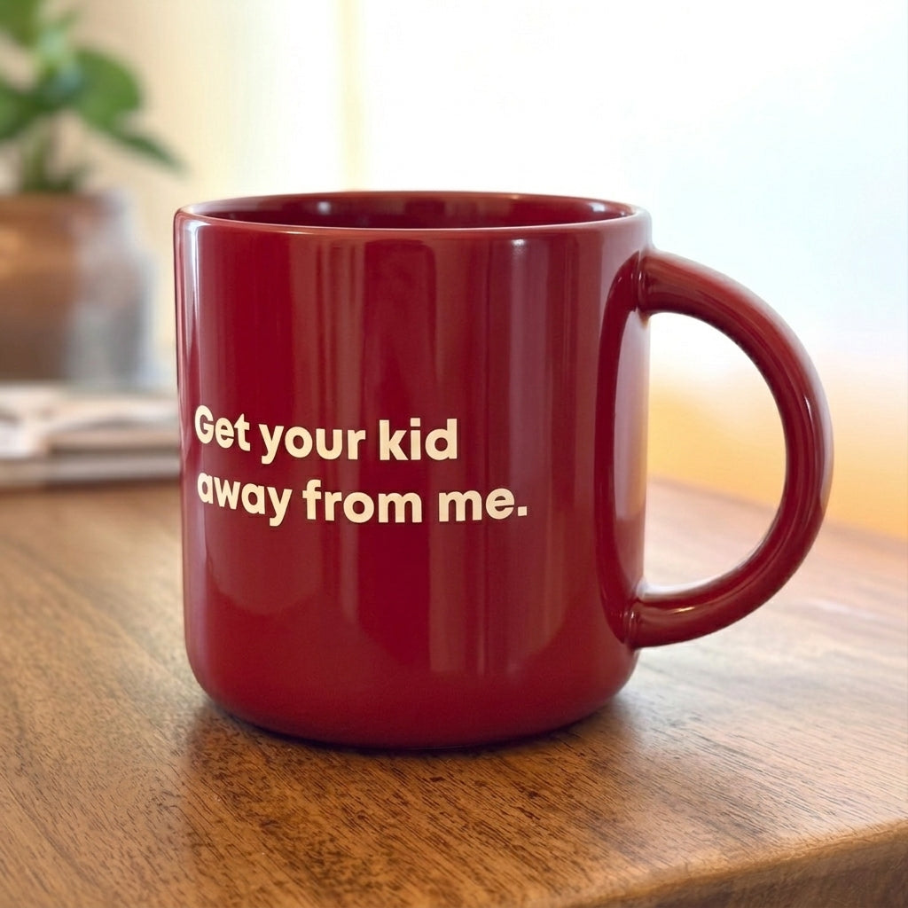 Coffee mug printed with “Get your kid away from me.”, additional view