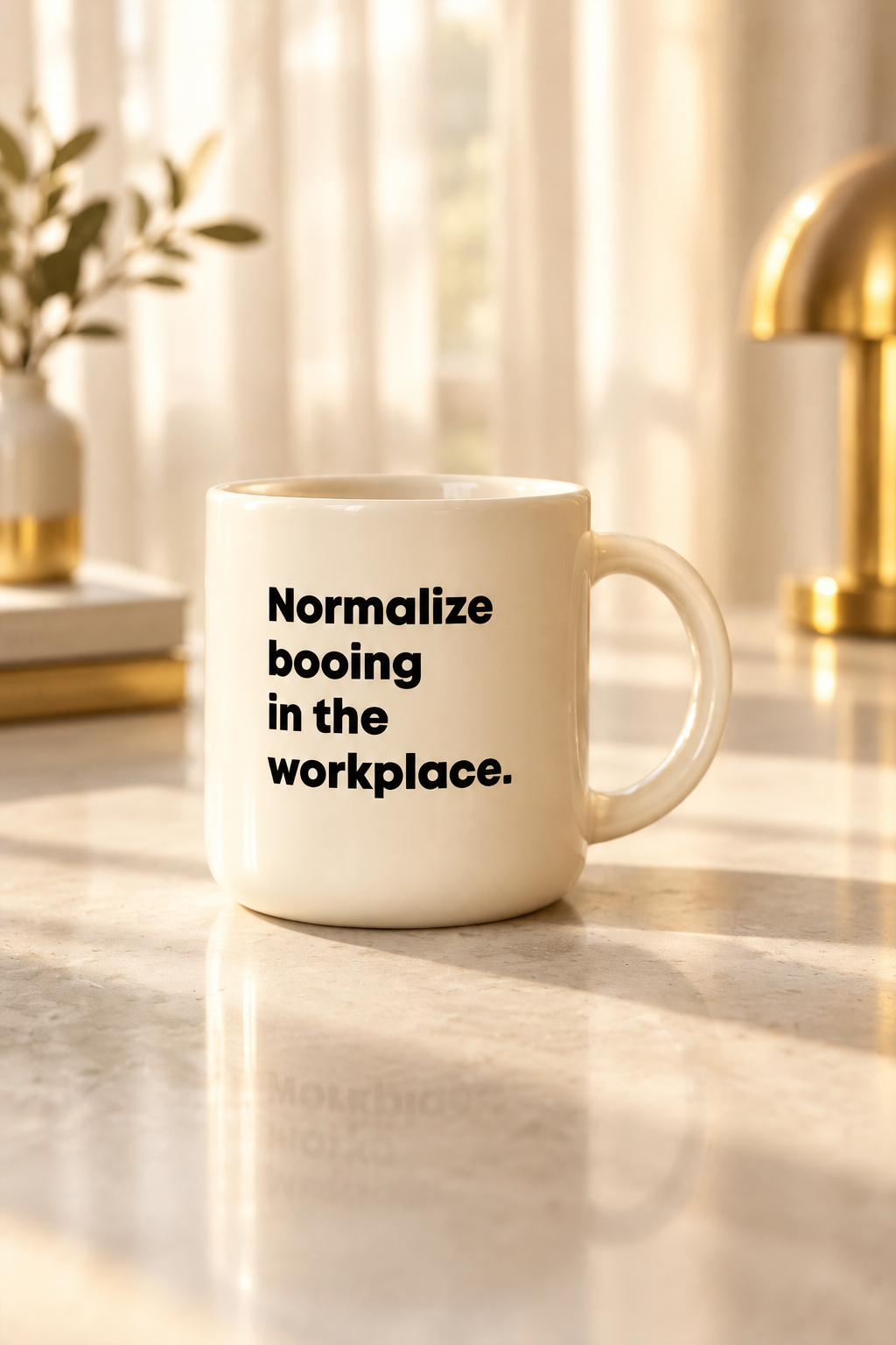 Coffee mug printed with “Normalize booing in the workplace.”, additional view