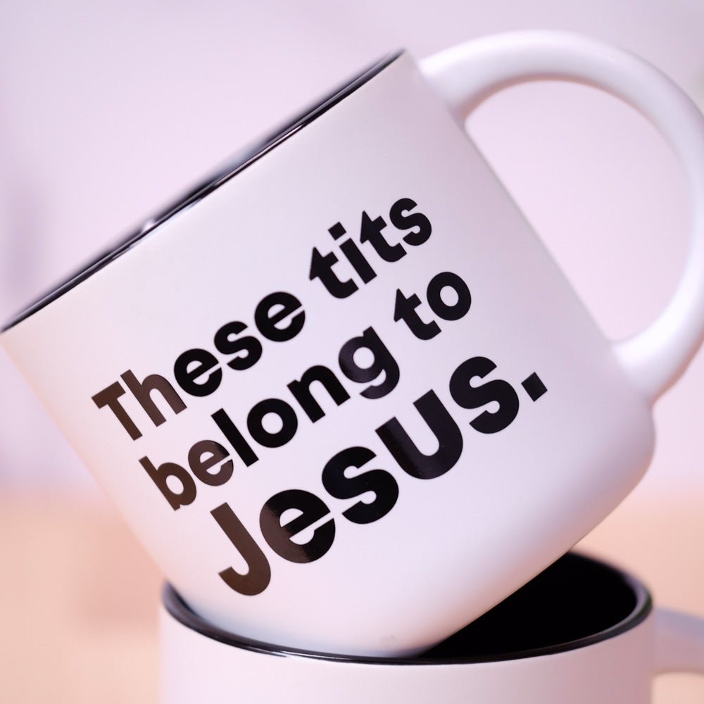 Coffee mug printed with “These tits belong to Jesus.”, additional view