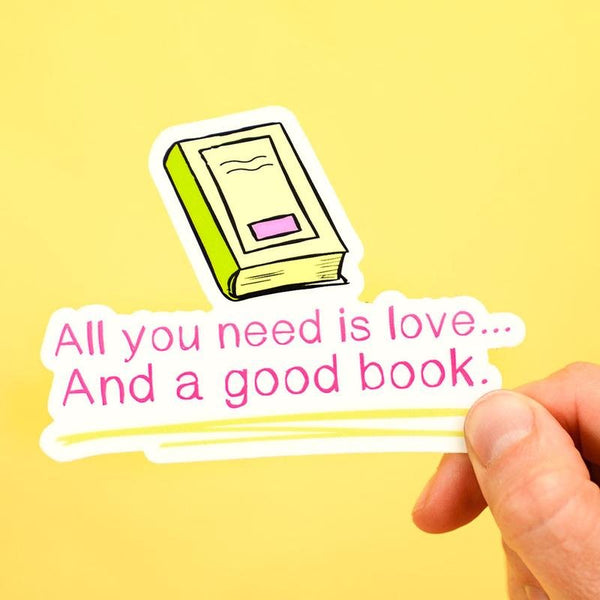 All you need is love... and a good book. Vinyl Sticker. - M E R I W E T H E R